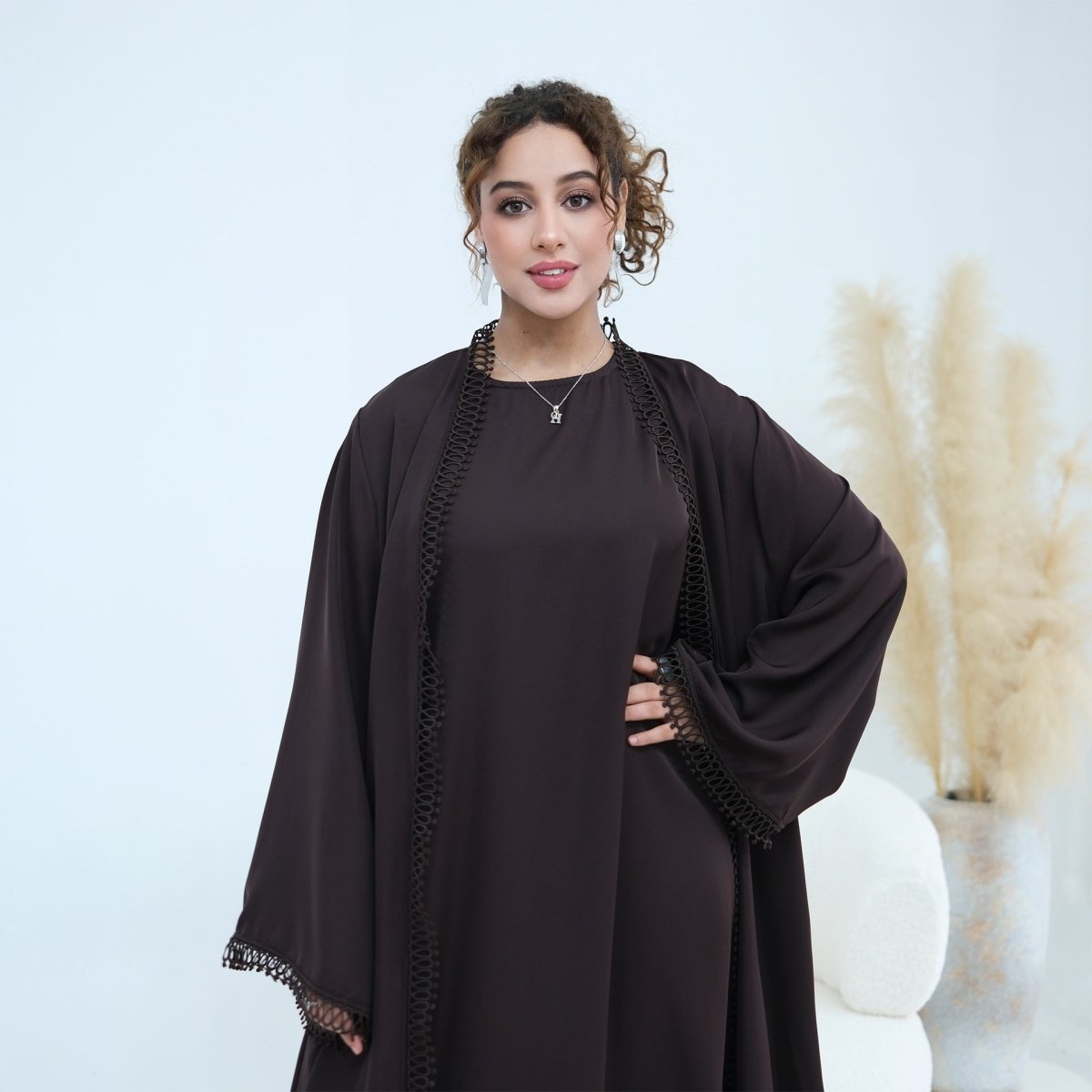 Side profile showing floor-length coverage of complete abaya set