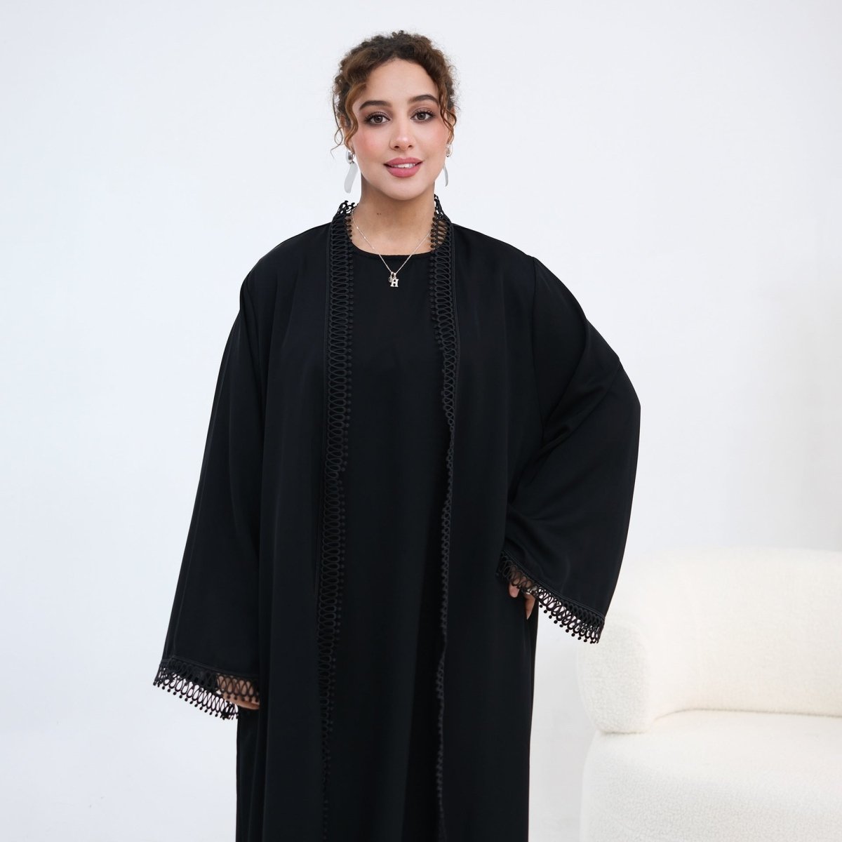 Full-length back view of open abaya and sleeveless inner dress set