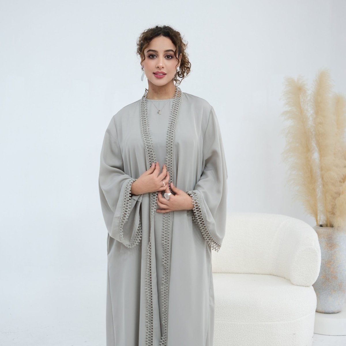 Round neckline detail of sleeveless inner dress from two-piece abaya set