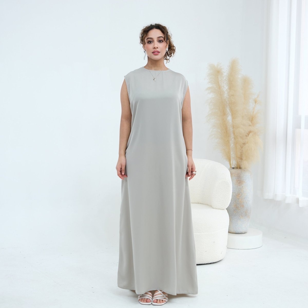 Detail of hidden back zip closure on fitted sleeveless inner dress