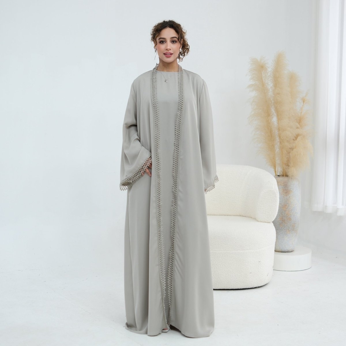 Side pocket detail discreetly placed in seam of open abaya