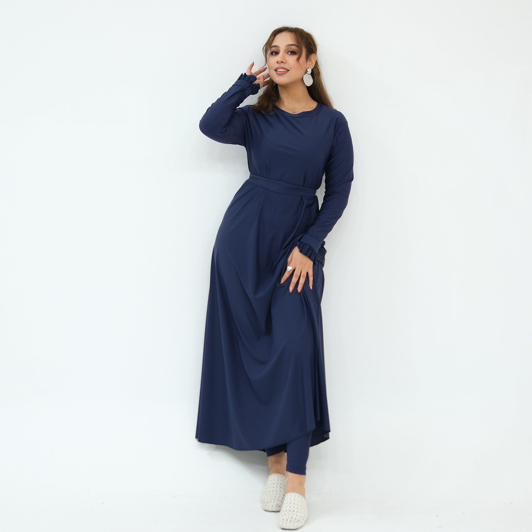 Side view of A-line swim dress with coordinating waist belt tied