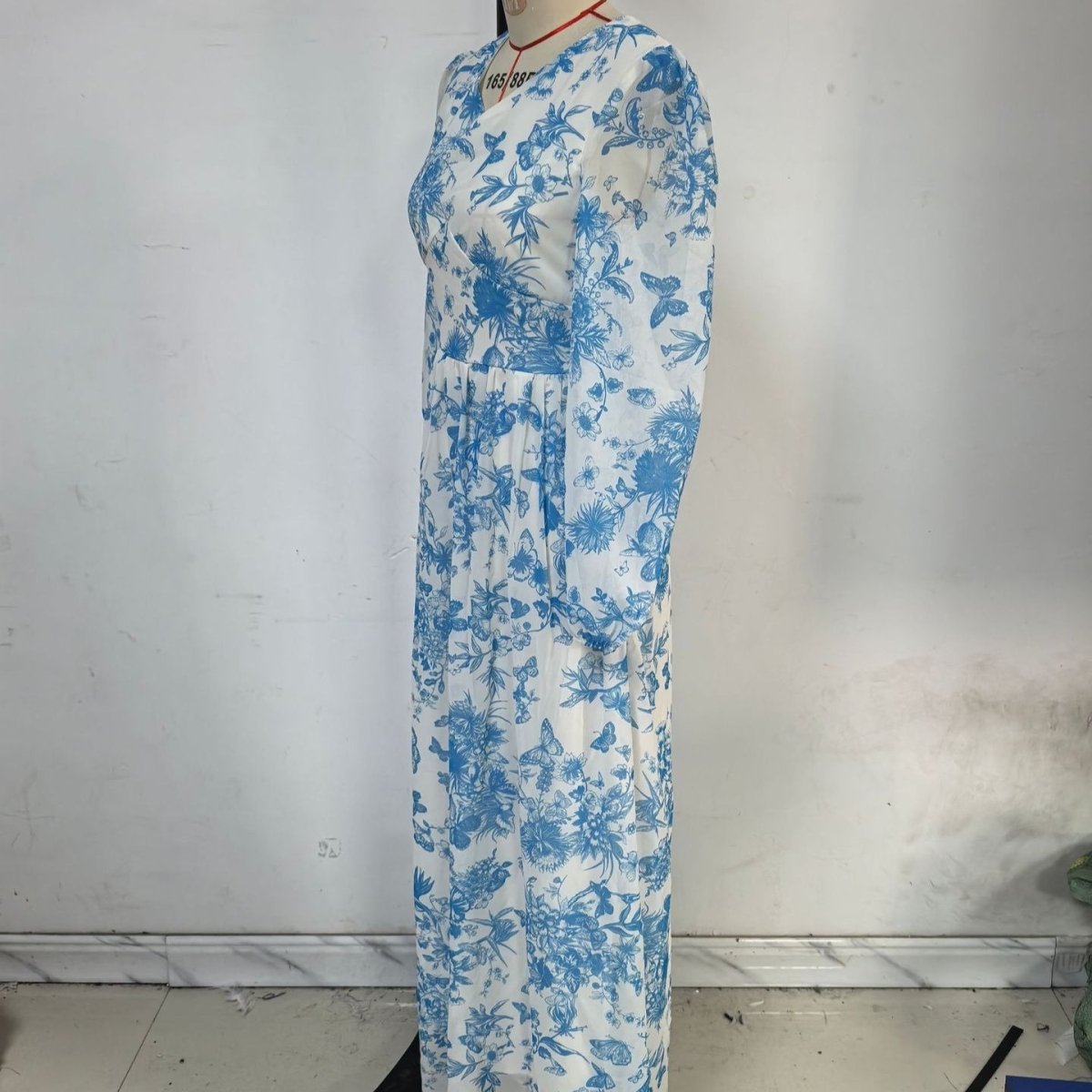 Botanical print gown with empire waist and soft drape fabric