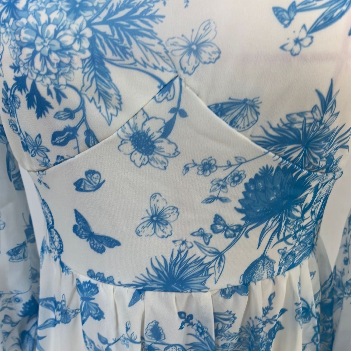 Floral print modest dress with flattering empire waist construction