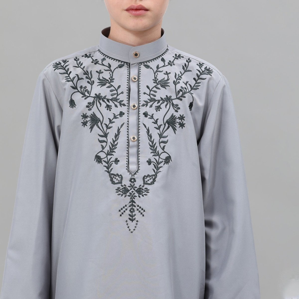 Silver snap button stand collar detail on boys' powder blue thobe