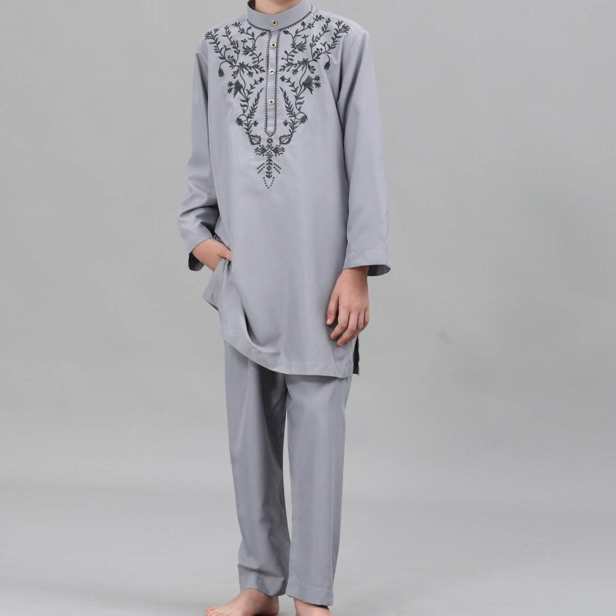 Front view of powder blue boys' thobe showing black floral chest embroidery
