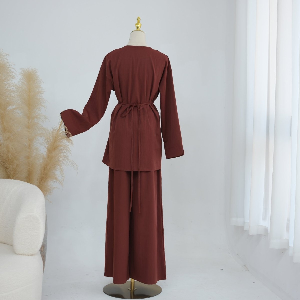 Relaxed wide-leg silhouette from hip to hem on modest two-piece set