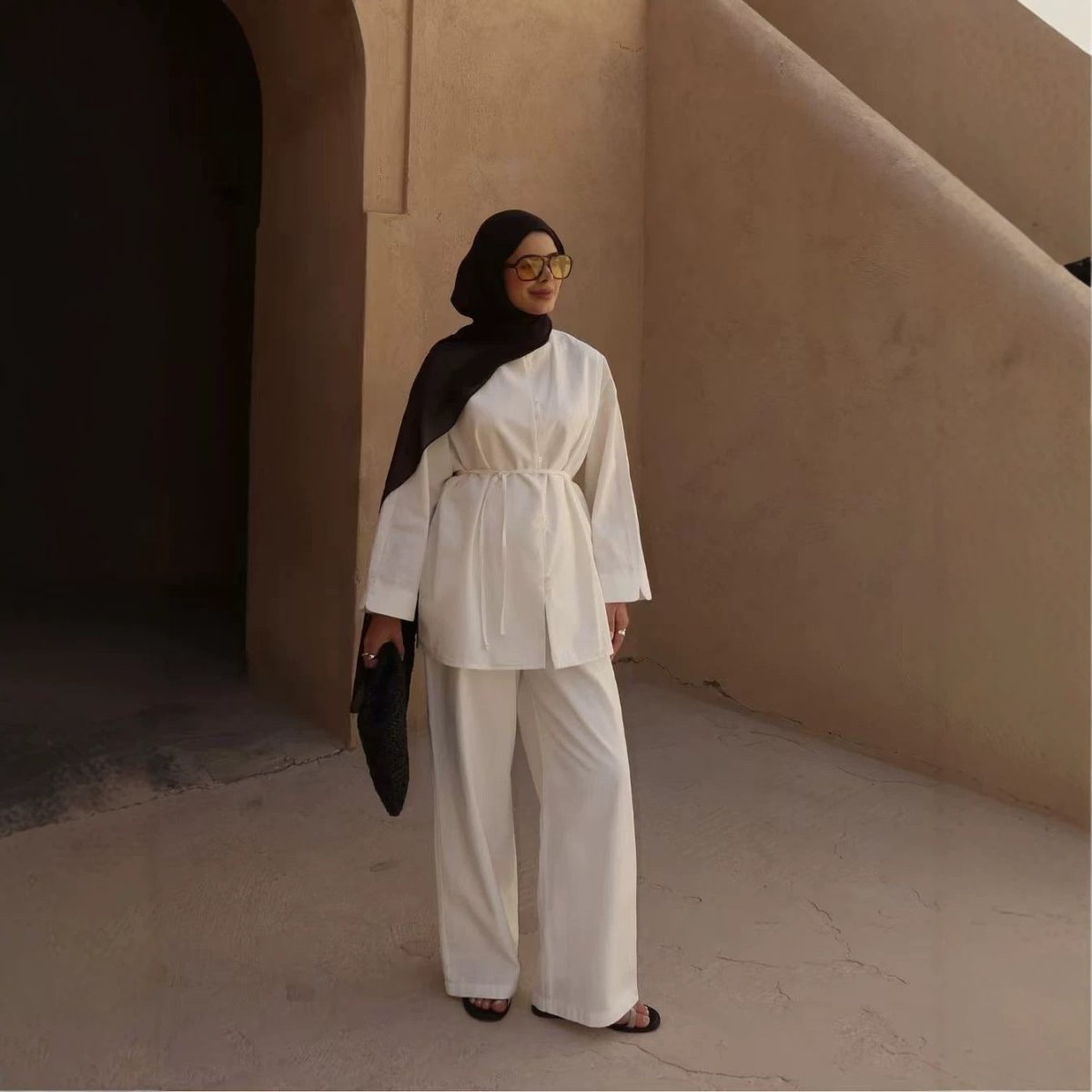 Back view showing self-tie waist cord on button-front longline top