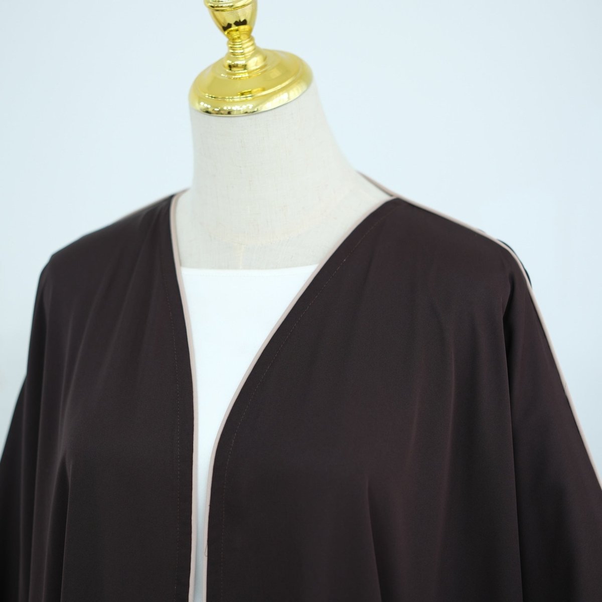 Batwing abaya worn in motion showing fluid fabric drape