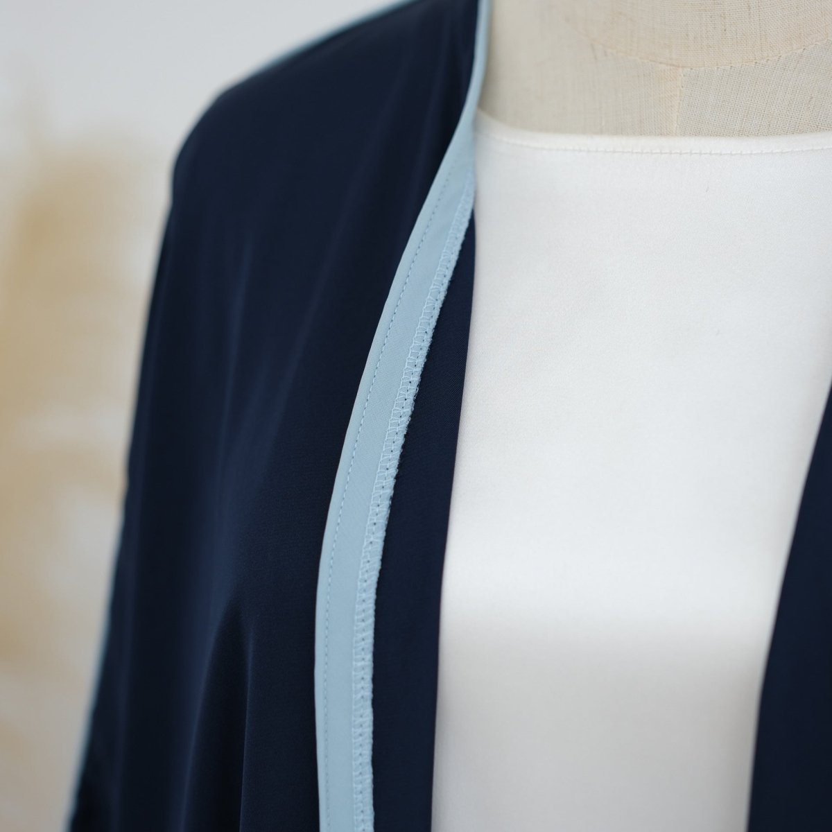 Back view of nida open abaya with relaxed straight silhouette