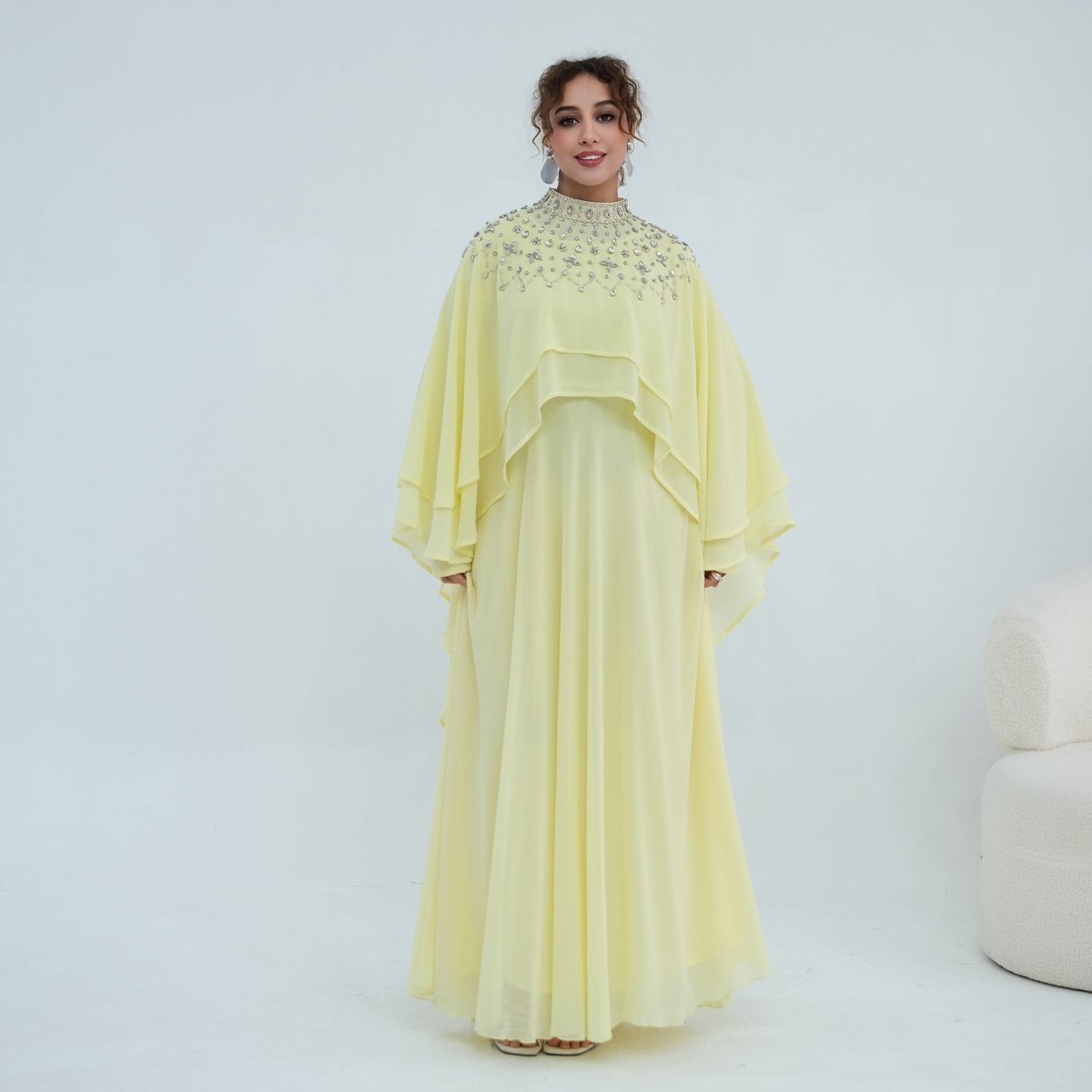 Waist detail showing adjustable self-tie cord on back of inner dress