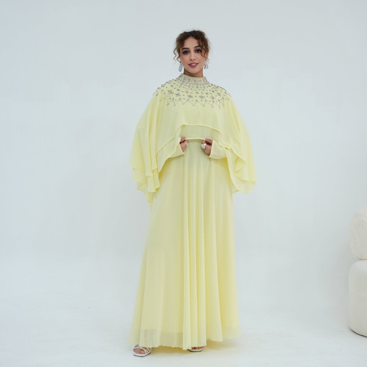 Front view of crystal and pearl embellished stand collar cape overlay