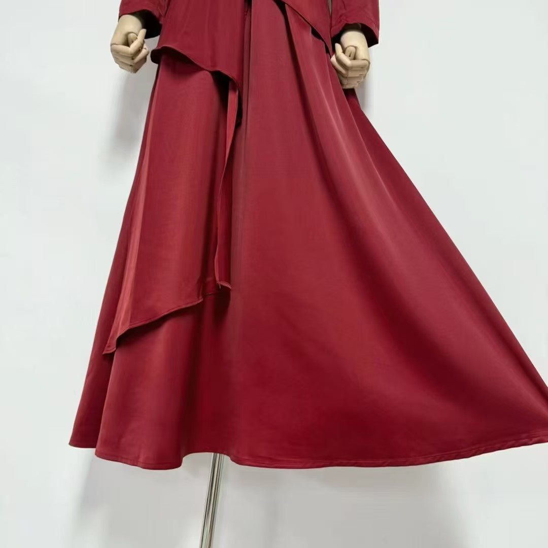 High mock neckline and structured shoulders detail on formal satin dress