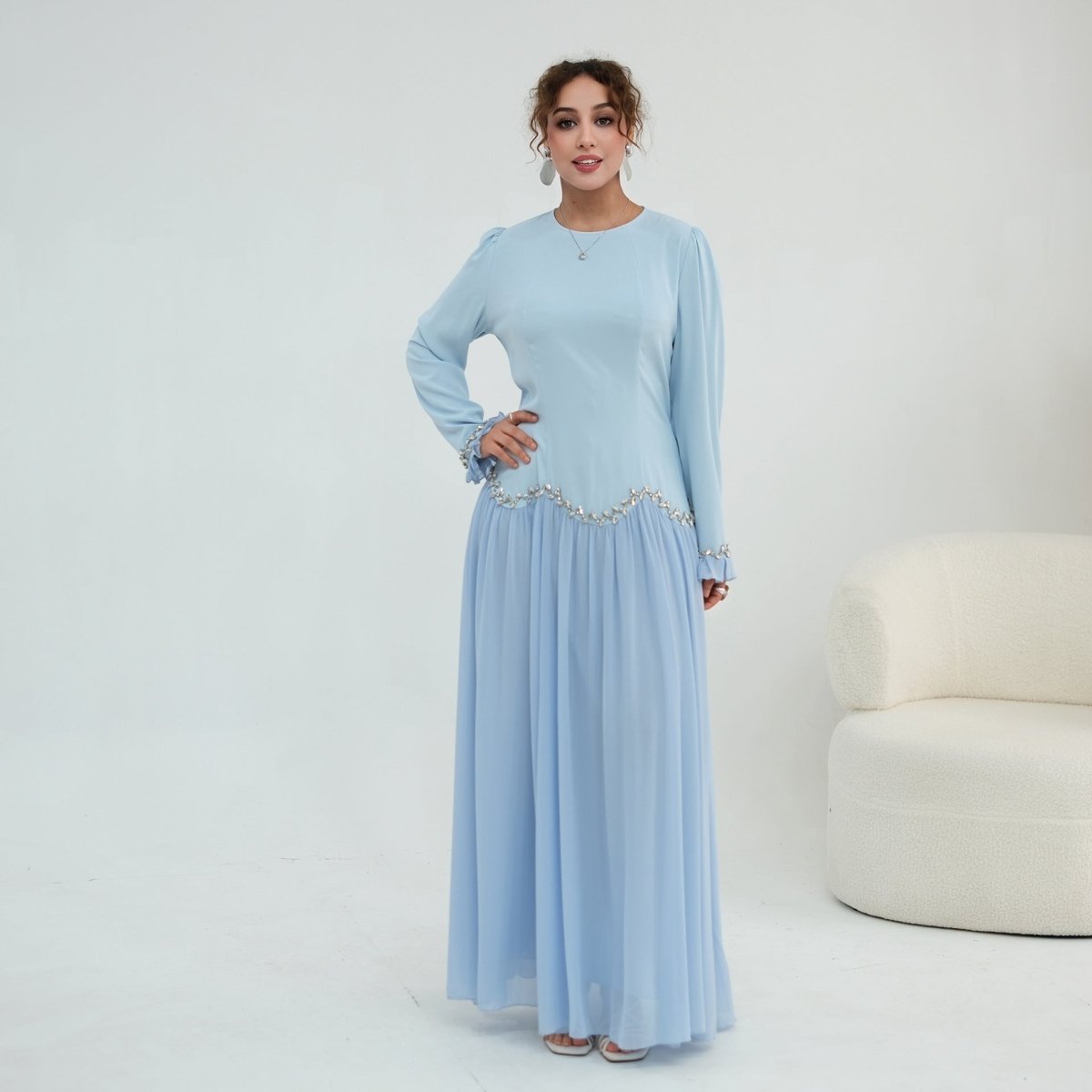 Three-quarter view of crystal maxi dress silhouette