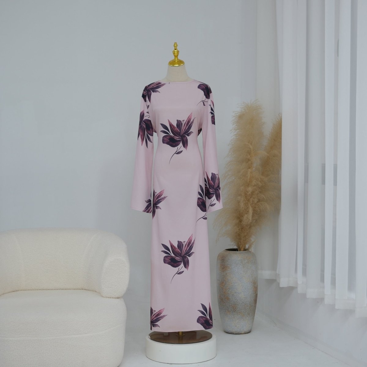 Side profile of flowing A-line silhouette on botanical print cape sleeve dress