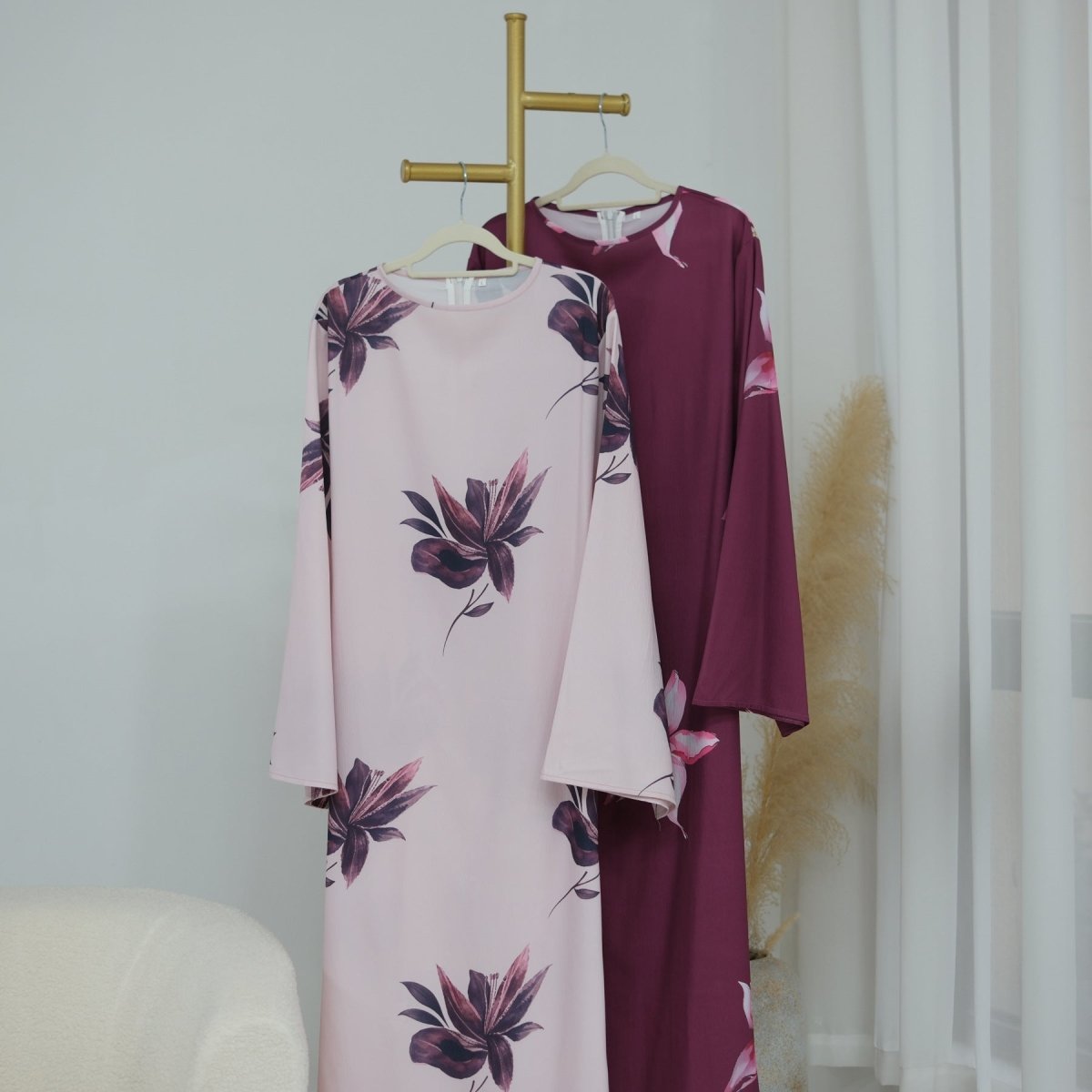 Back view showing hidden zip and self-tie sash waist detail on floral maxi dress