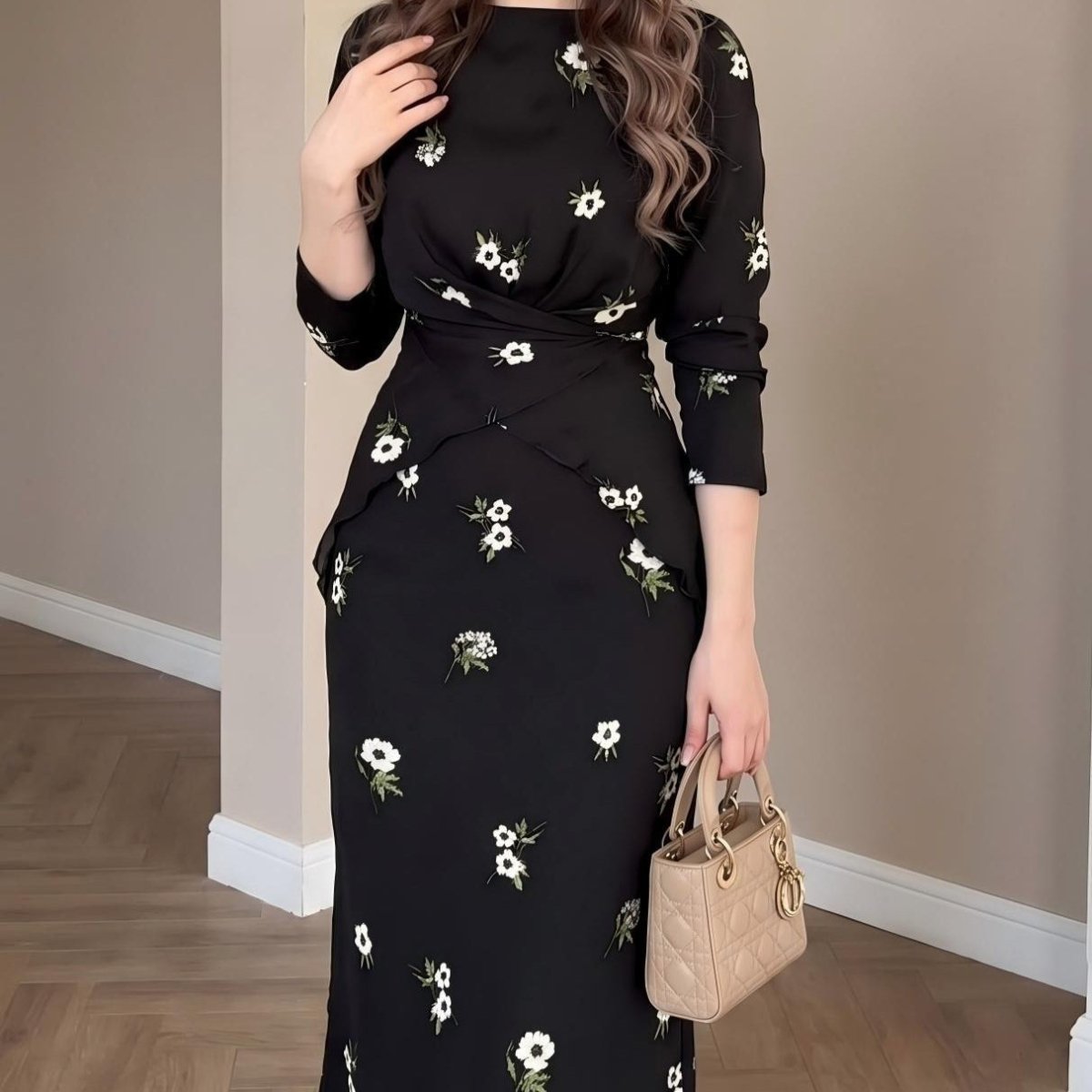 Close-up of twist-front waist detail on floral print midi dress