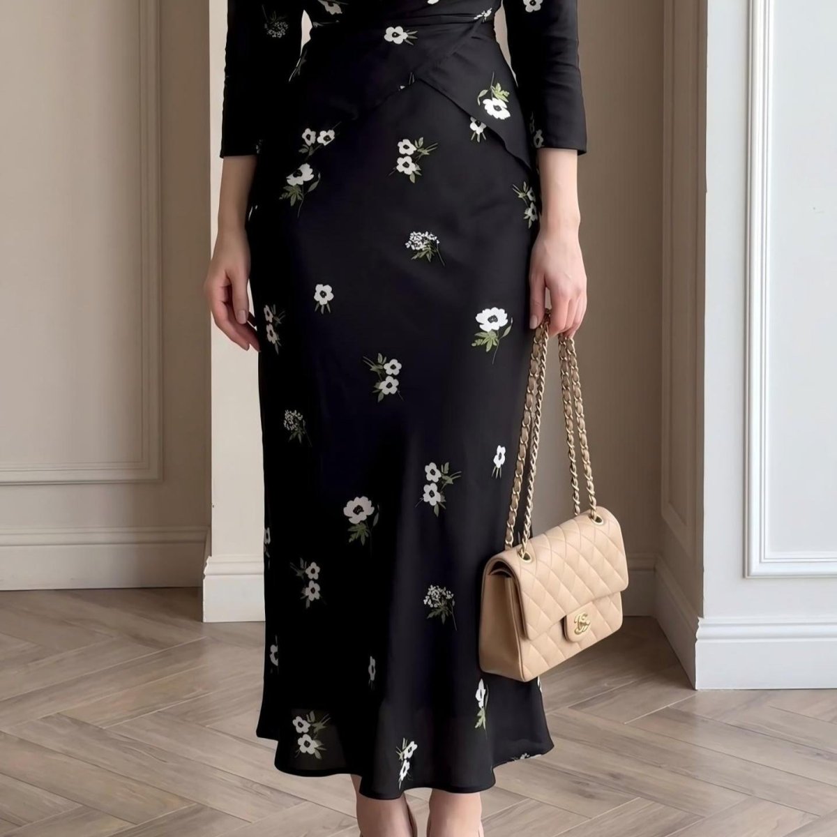 Full-length side view showing A-line midi skirt and three-quarter sleeves