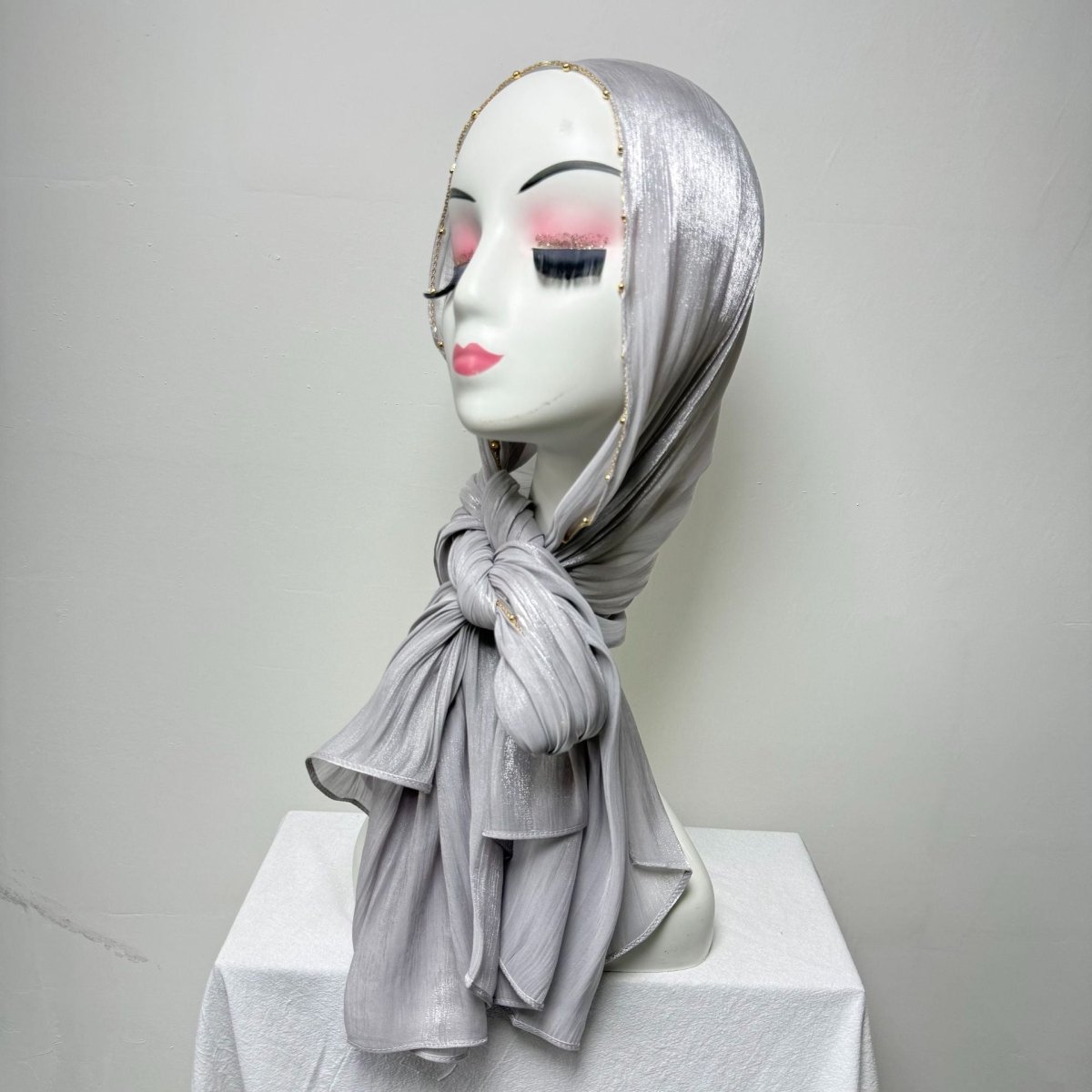 Soft neutral tone crinkle satin hijab with gold beaded chain edge