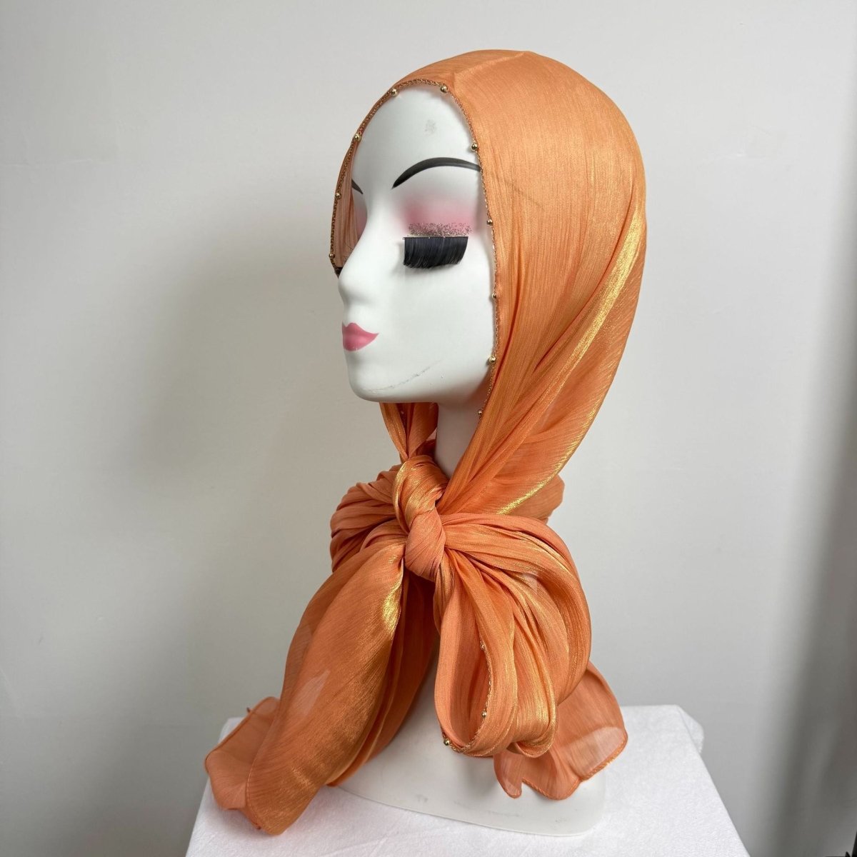 Shimmer satin hijab colour swatch display — soft neutrals and muted tones