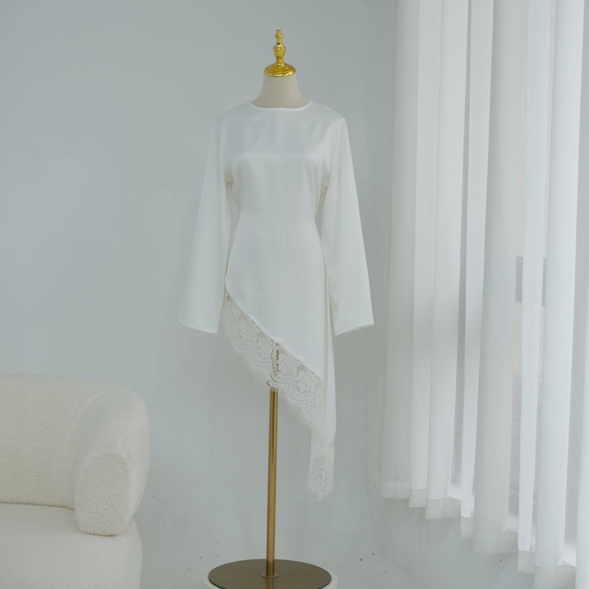 Waist ribbon left loose for relaxed drape on satin top