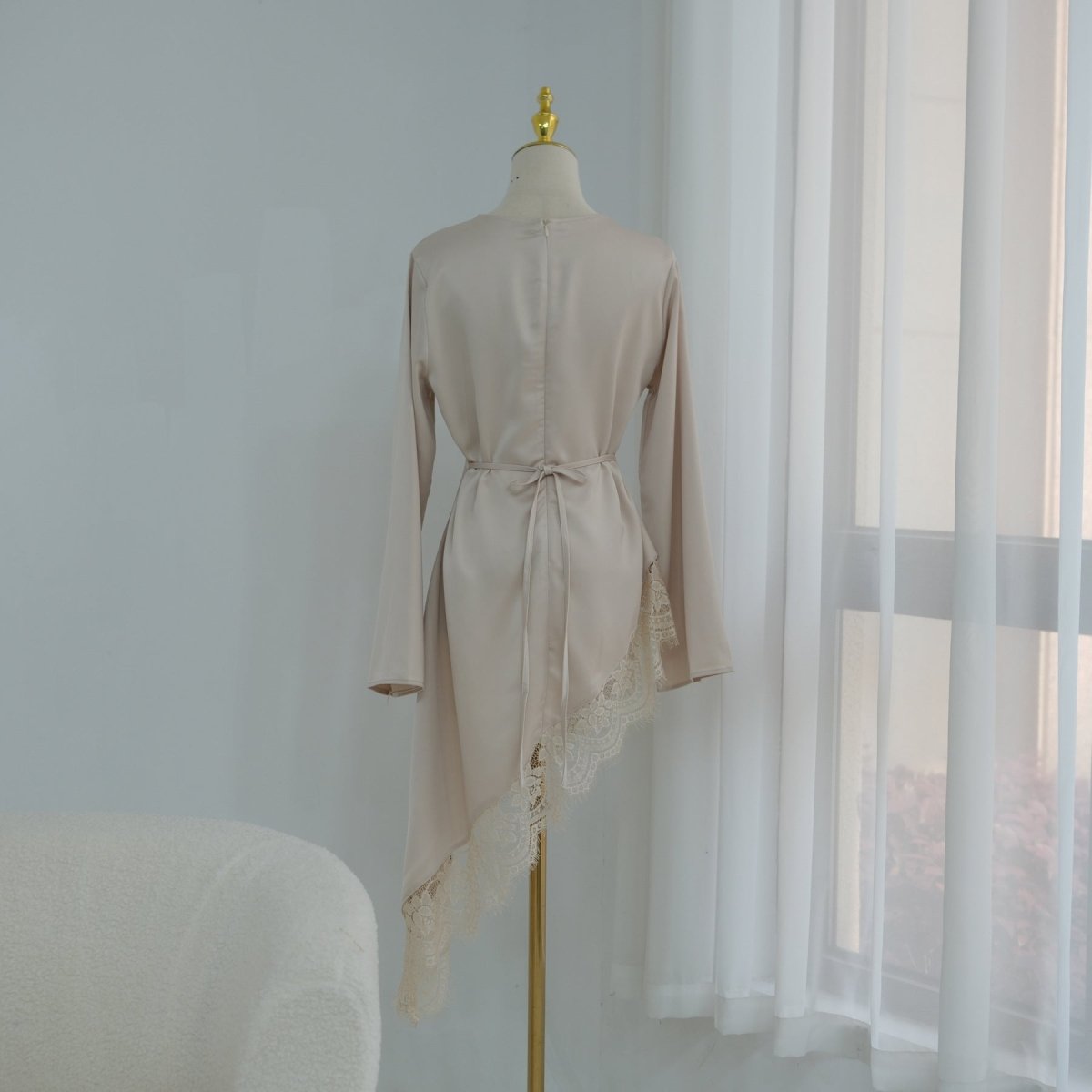 Back button neckline closure on lace trim satin top