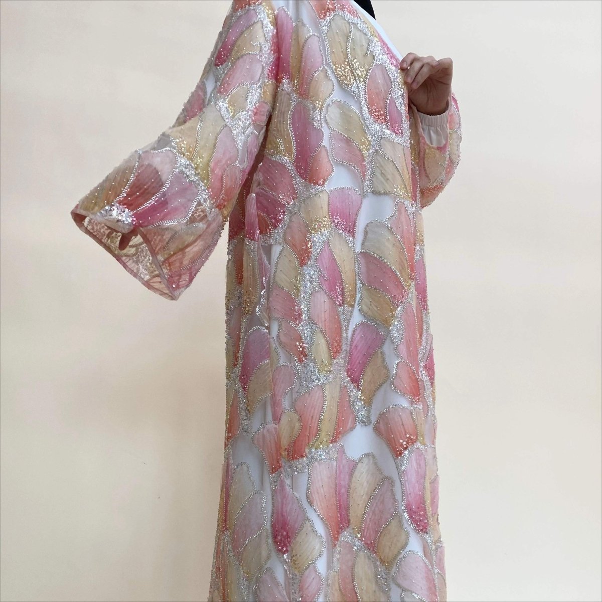 Petal Glow abaya with intricate hand-stitched floral detail on couture lace