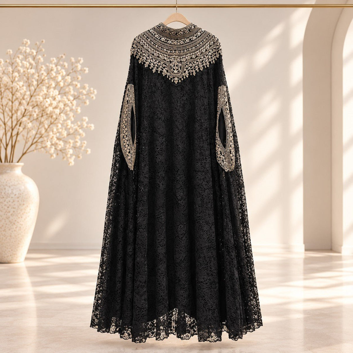 Side profile of layered lace abaya top set with three-quarter sleeve inner