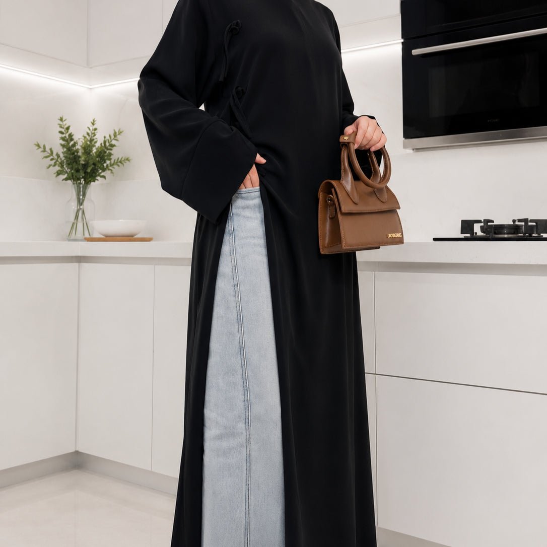 Close-up of batwing sleeve and folded cuff detail on Nida longline tunic