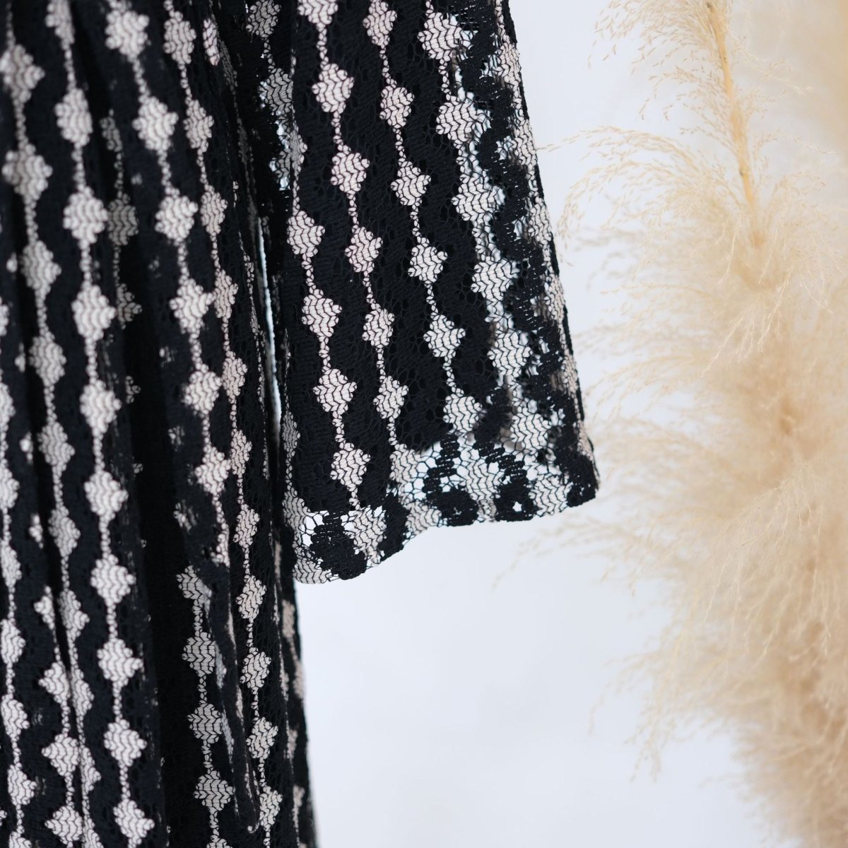 Detail of waist loops and self-tie belt on lace abaya