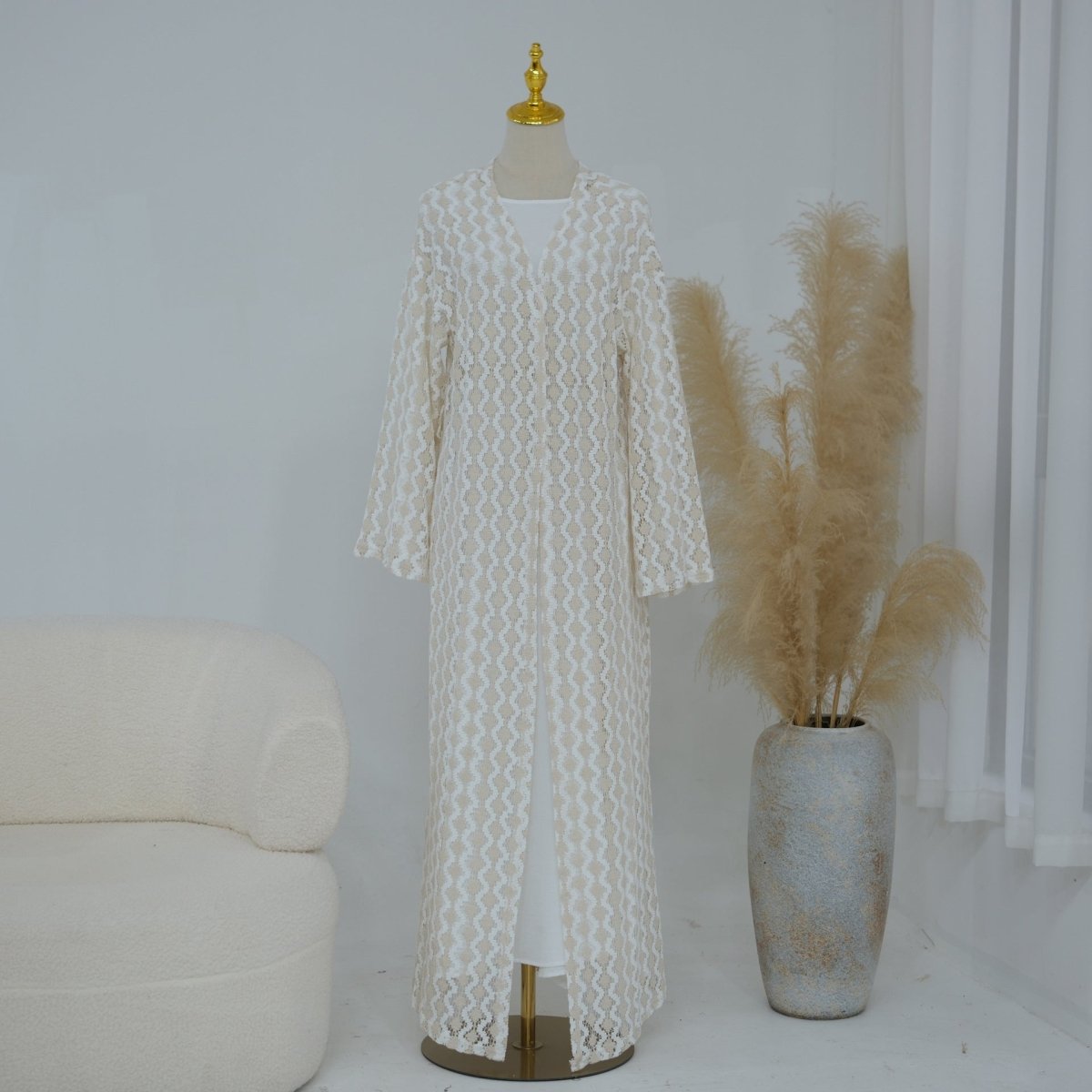 Side view of lightweight lace abaya layered over modest inner dress