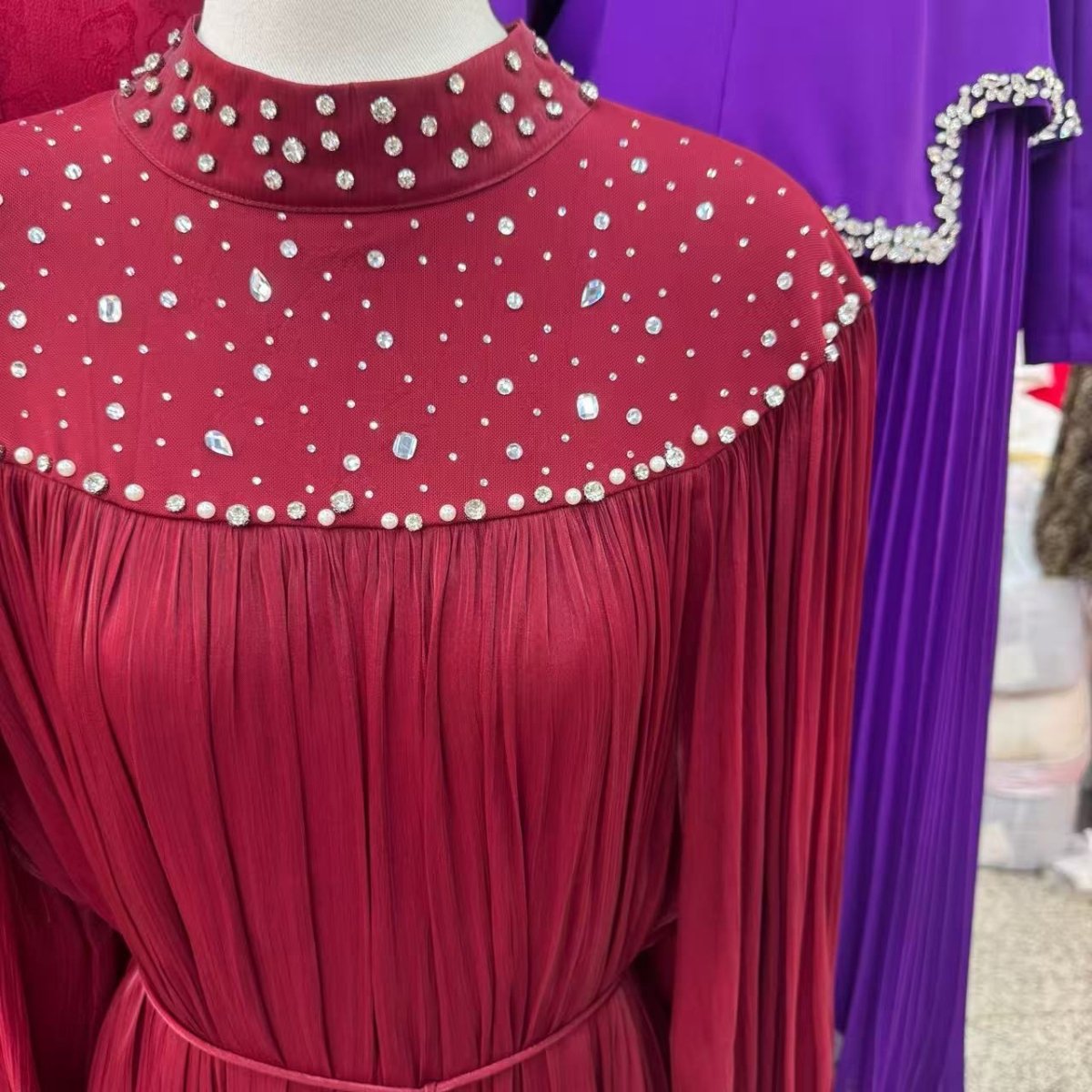 Back view of pearl embellished yoke maxi dress showing gathered sleeves