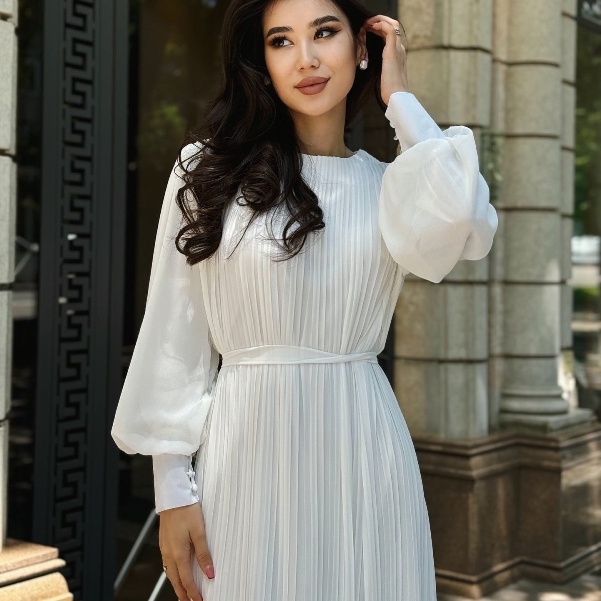 Natural drape of lightweight fabric on modest pleated abaya dress