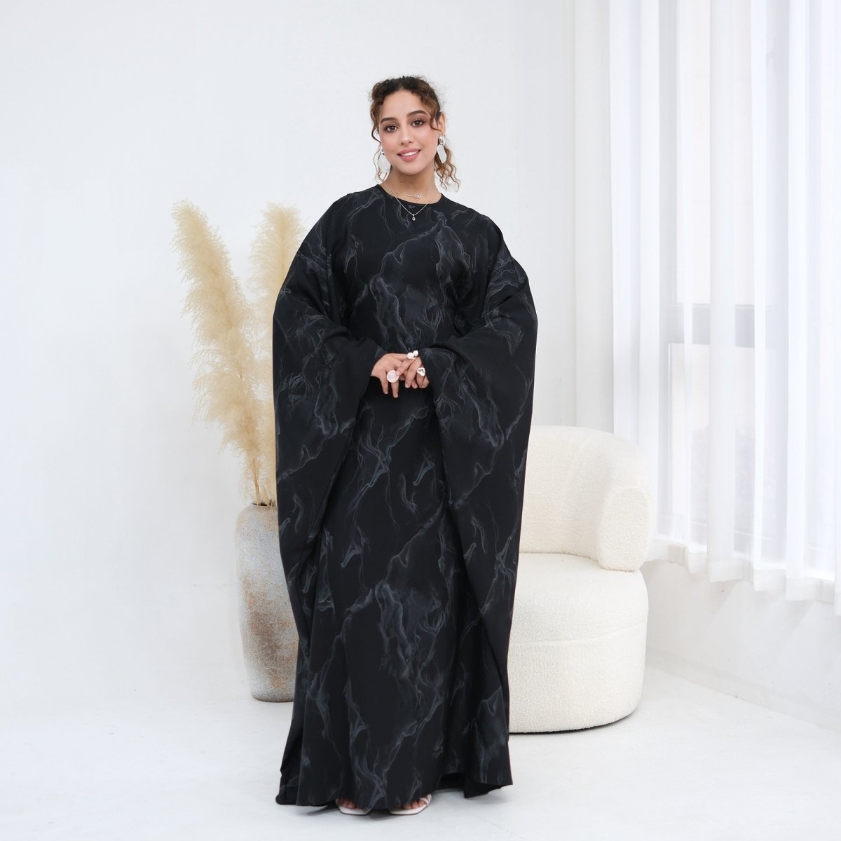 Sleeve and shoulder detail on gold print batwing modest maxi dress