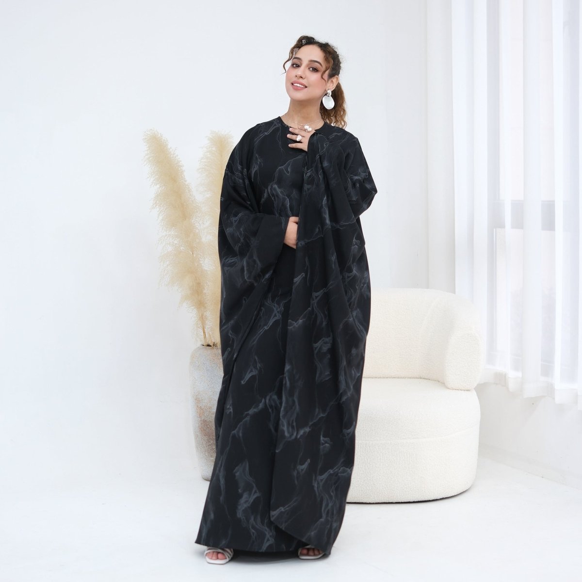 Gold print batwing maxi dress shown full-length from side