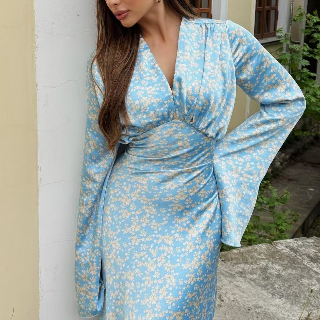Back view of satin floral maxi dress showing flowing silhouette and bell sleeves