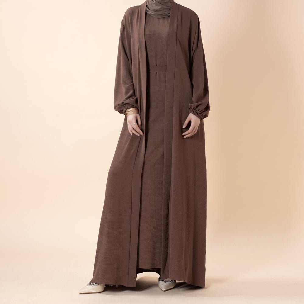Close-up of open-front hem and fabric drape of the crepe abaya