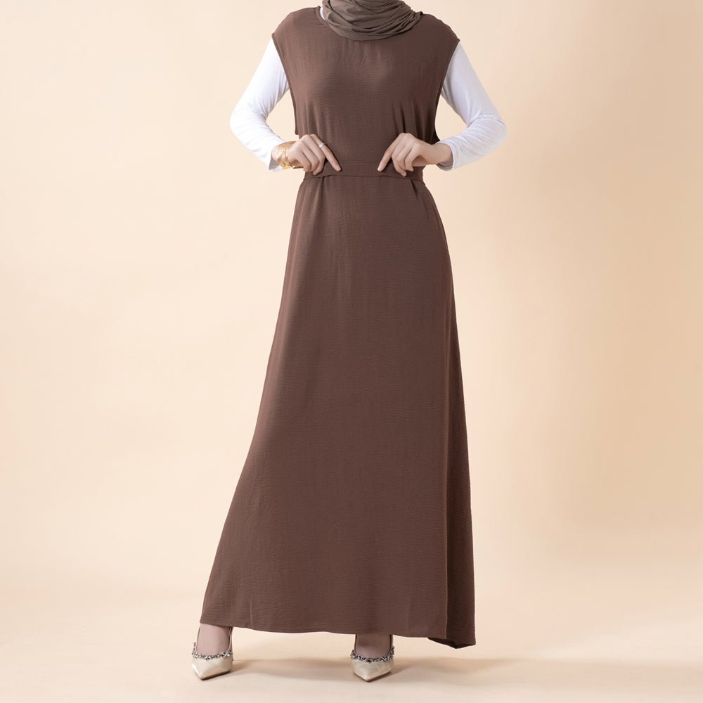 Three-quarter view of the belted open abaya showing waist definition