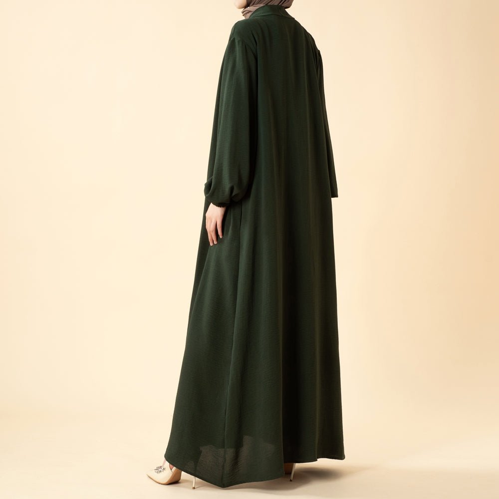 Abaya set showing open-front drape and sleeveless inner dress combination