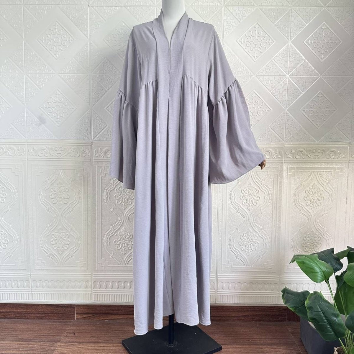 Modest layering abaya with wide shoulders and gathered seam detail