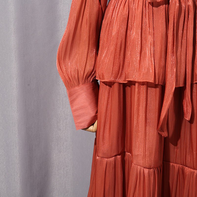 Back view of tiered ruffle maxi dress with fitted waist in coral terracotta