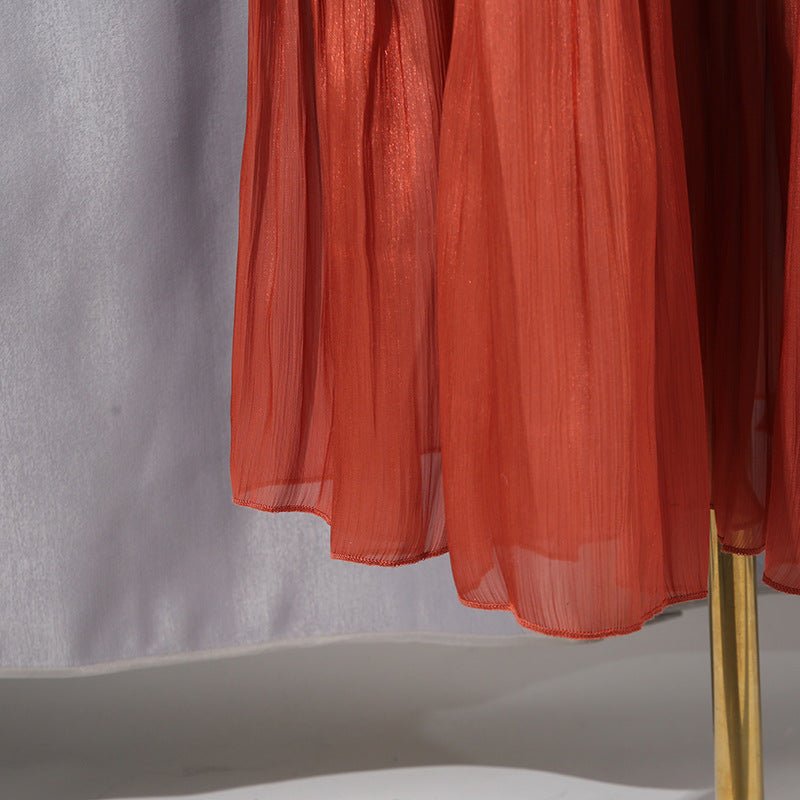 Tiered ruffle skirt close-up showing multiple layers and satin drape