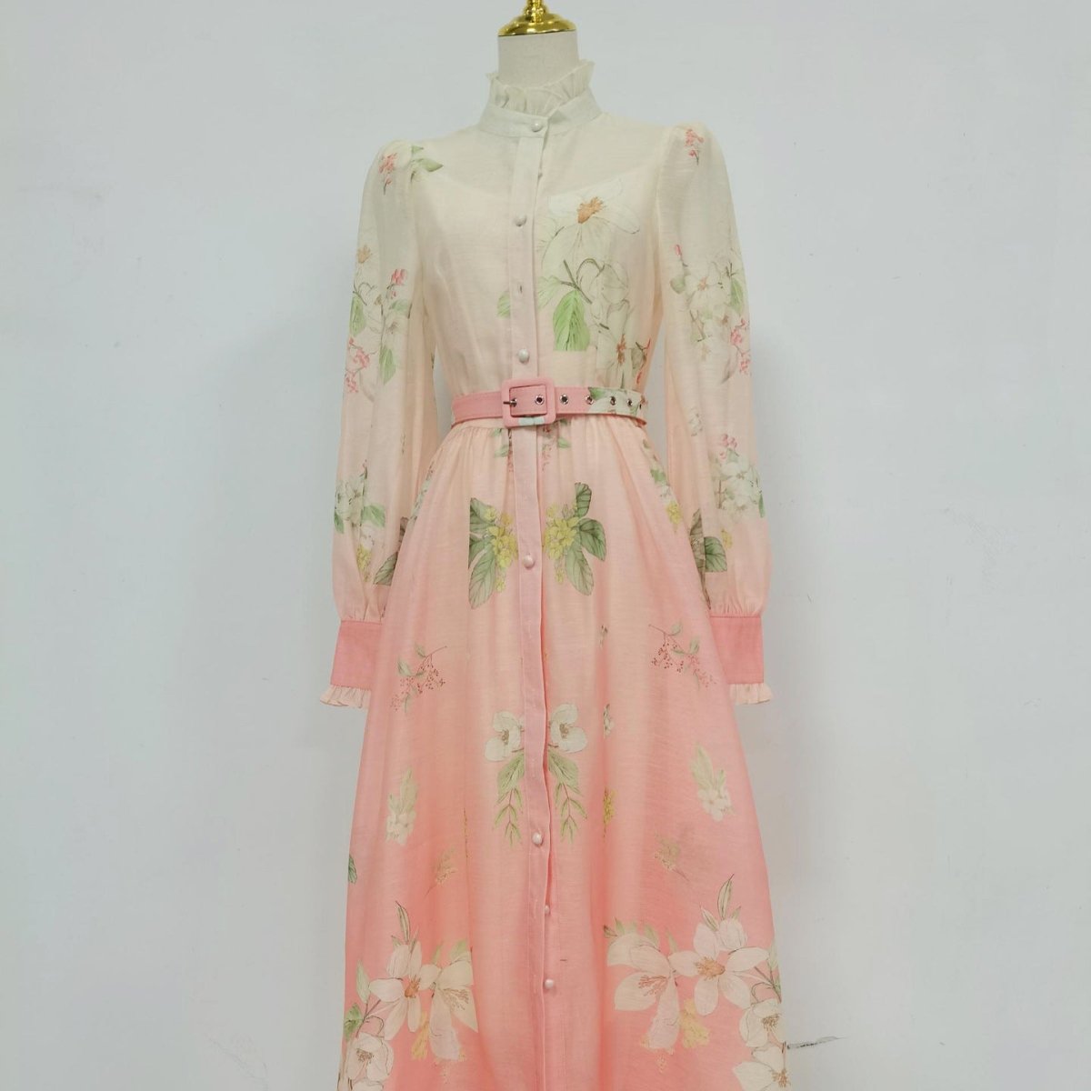 Front view of ombré floral maxi dress with pearl button placket and matching belt