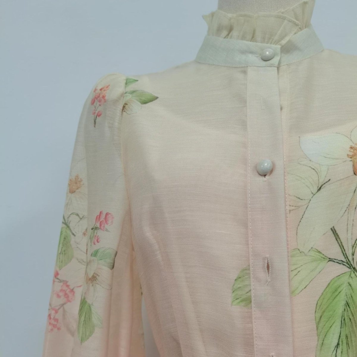 Side profile of vintage floral maxi dress showing full-length button-front silhouette