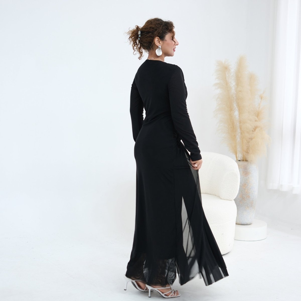 Back view showing full-length silhouette of woven bodice mesh maxi dress