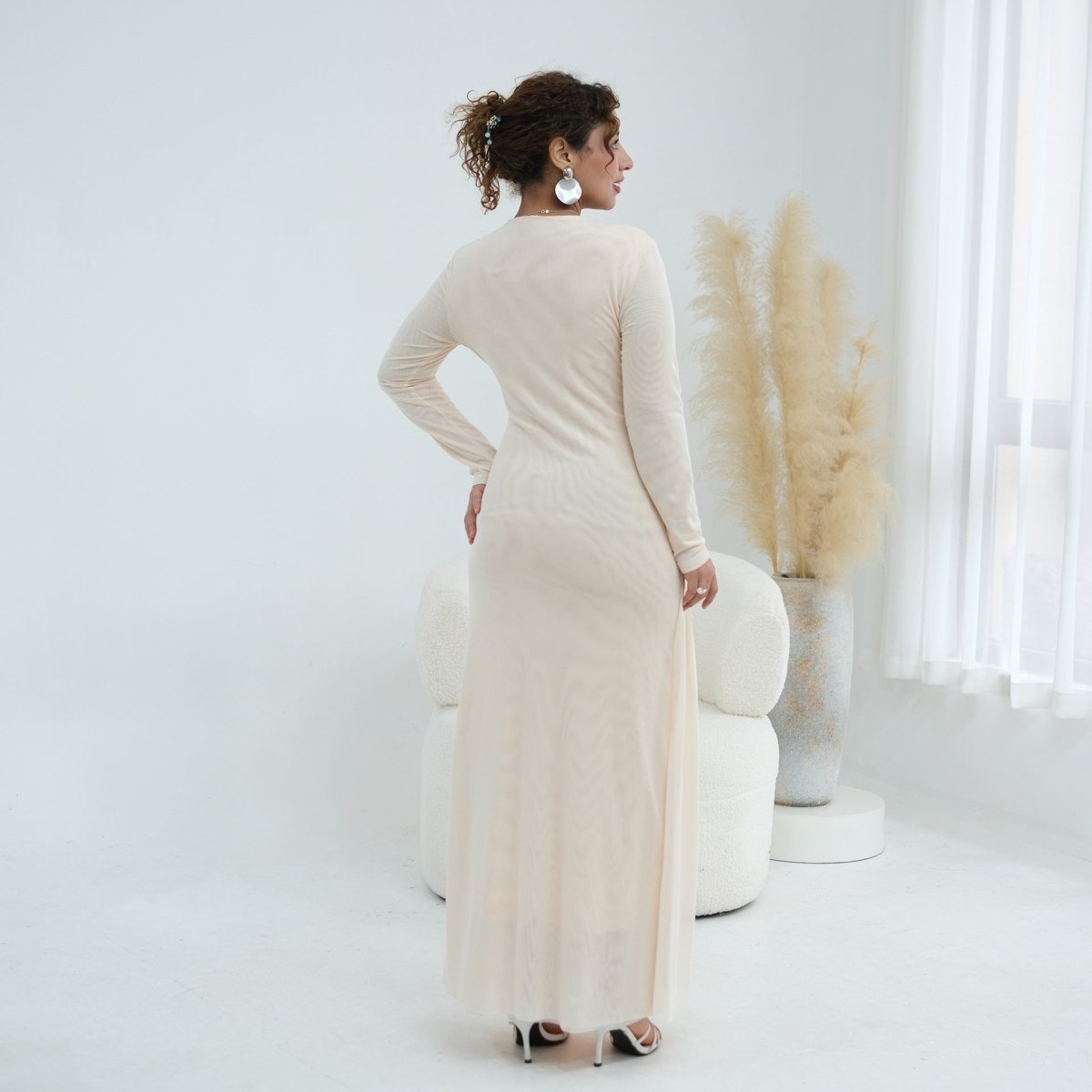 Back view of woven cross-strap bodice mesh maxi dress in full length