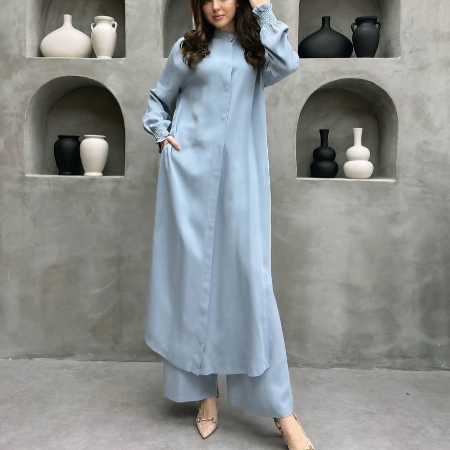 Full-length view of wide leg elastic waist pants paired with longline shirt