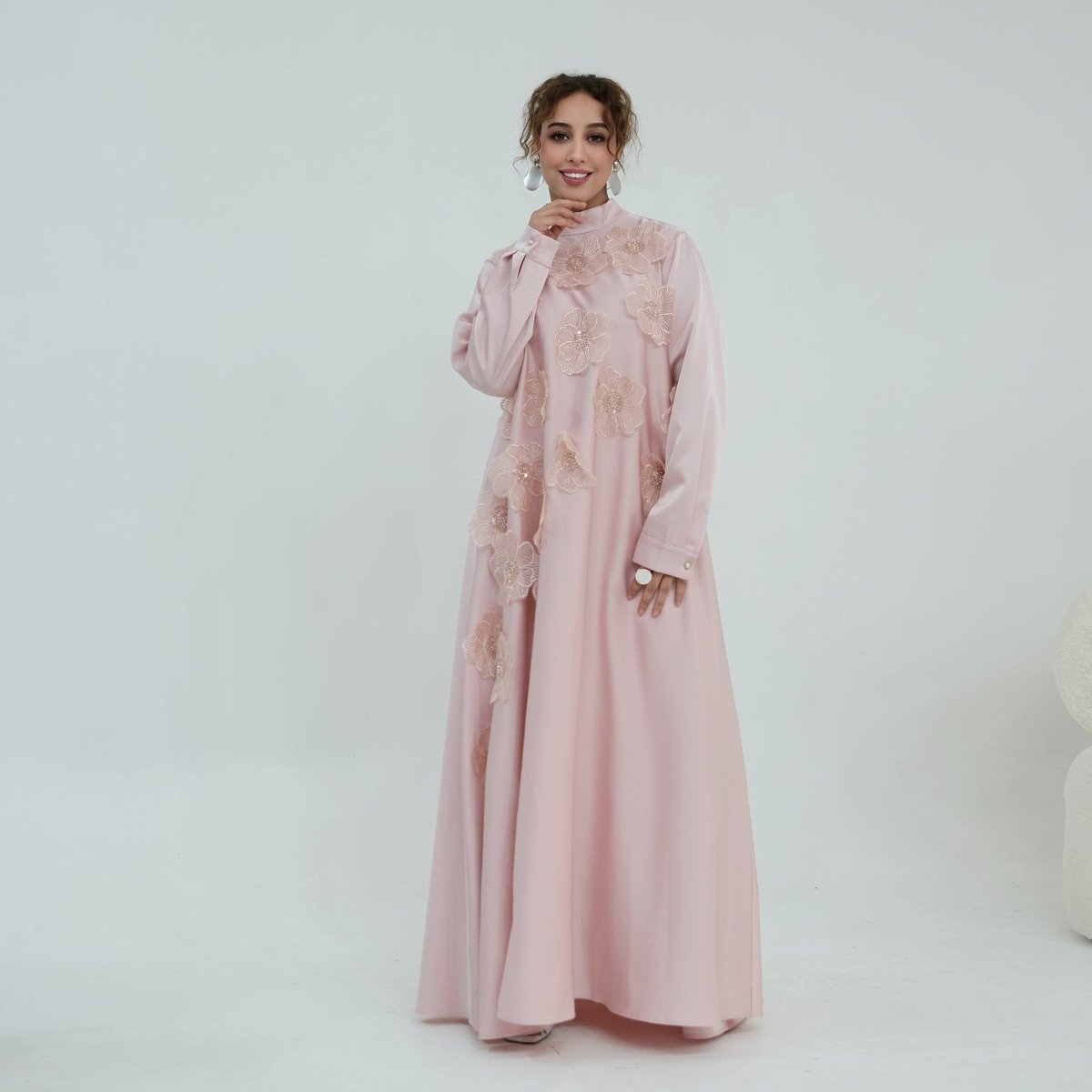 Back view of maxi dress showing self-tie ribbon bow at stand collar neckline