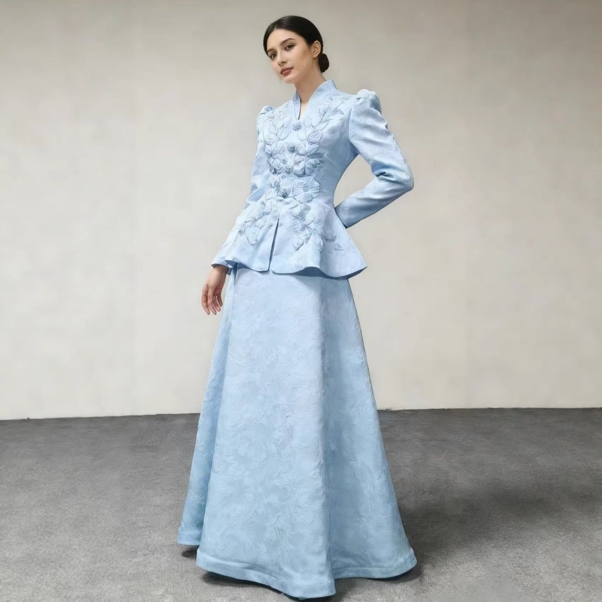 Close-up of hand-set crystal and pearl beading on 3D floral embroidered bridal peplum top