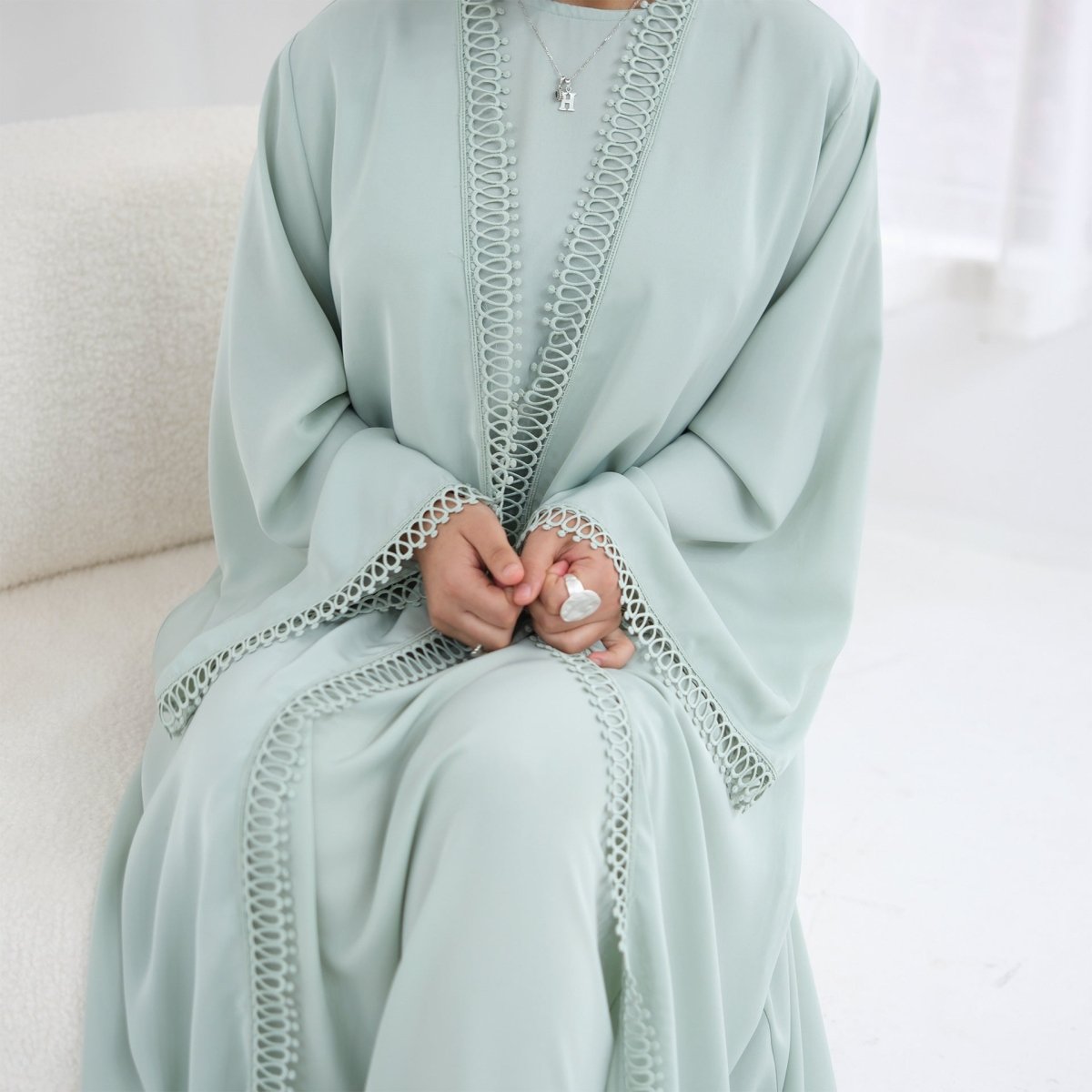 Open abaya flowing silhouette from front angle